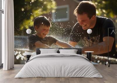 Father and son are bonding while washing their car on a sunny summer afternoon Wall mural