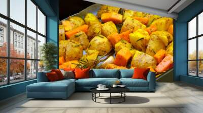 Pumpkin and potatoes cut with various spices, ready to be baked Wall mural