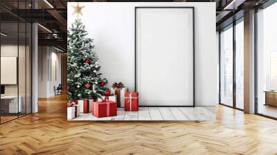 A decorated Christmas tree with presents underneath. leaning against a blank framed poster in a minimalist interior with a white wall and wooden floor Wall mural