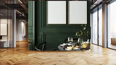 A minimalist dining room with a black round table, two black chairs, and two empty frames on a dark green wall. The table is set for a romantic dinner with wine glasses, a plate, and cheese Wall mural