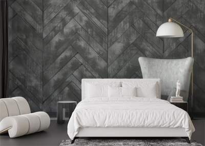 A modern grey armchair with a side table and lamp in a minimalist living room with a herringbone wood wall Wall mural