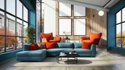 A modern living room with two orange armchairs. a coffee table. and four blank picture frames on a wood wall Wall mural