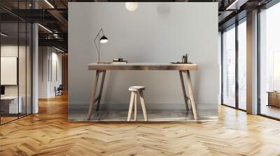 A simple, minimalist wooden desk and stool are set against a clean white wall. Natural light floods the scene, highlighting the desk's rustic charm and creating a serene workspace Wall mural