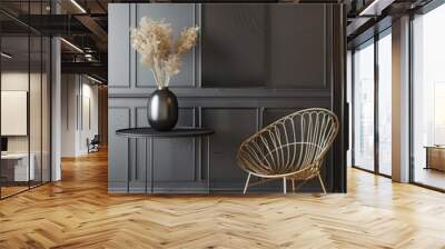 A stylish gold chair and a black side table with a vase of dried flowers stand in front of a black paneled wall. Wall mural