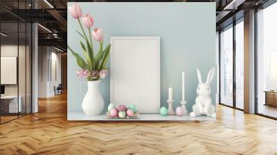 Easter mockup with blank white frame, pink tulips in vase, colored eggs, bunny figurine and candles. Spring holidays greeting card template, light blue background Wall mural