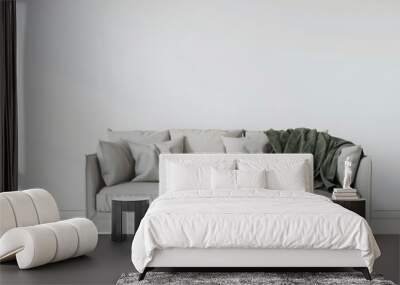 Minimalist living room interior with a white sofa. a green throw blanket. and natural light Wall mural