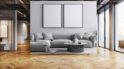 Minimalist living room interior with two blank frames above a grey sofa and a round coffee table Wall mural