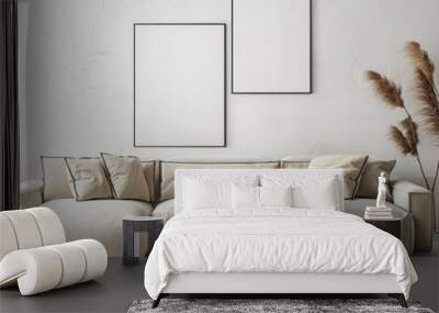 Modern living room interior with a beige sectional sofa. two framed posters. wooden coffee tables. a rug. and dried flowers Wall mural