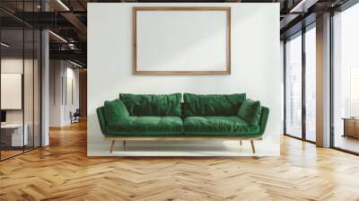 Modern living room interior with a green velvet sofa and a blank picture frame. Stylish home decor with copy space for art or design Wall mural