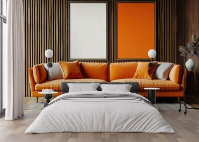 Modern living room interior with an orange sofa. two black coffee tables. and two framed posters on a wood wall Wall mural