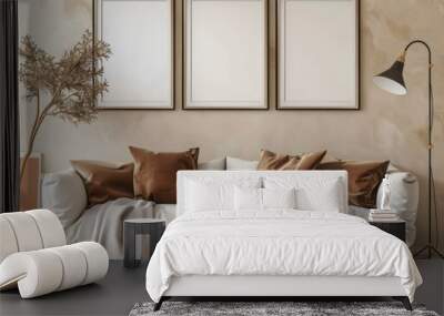 Modern living room interior with three blank frames above a white sofa, brown pillows and a wooden coffee table, perfect for showcasing your artwork, designs, or branding Wall mural