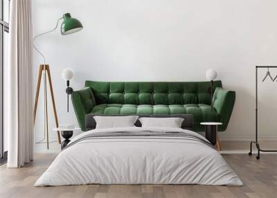 Stylish green velvet sofa and a modern floor lamp in a minimalist interior with a white wall. Interior design concept Wall mural