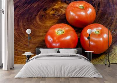 Ripe tomatoes on rustic wooden board Wall mural