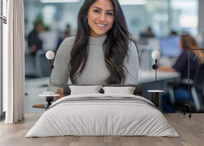 attractive hispanic woman in her late thirties, wearing business casual attire and smiling Wall mural