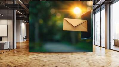 Close-up of a mail slot with a letter being dropped in symbolizing connection and communication Wall mural