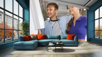 Caucasian kids boy and girl learning with computer  Wall mural