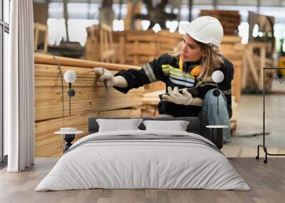 Caucasian technician craft woman holding clipboard with stock timber background at wood factory	 Wall mural