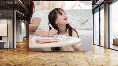 Happy daughter learning art drawing with mother at home	 Wall mural