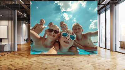 Happy family with children in swimming pool having fun. Summer vacation concept Wall mural