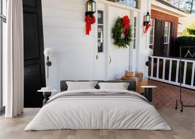 Packages on front porch of home during holiday season Wall mural