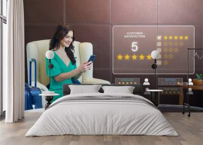 Tourist give rating to service experience on mobilephone, evaluate quality of service leading to reputation ranking of hotel business. Customer review satisfaction feedback survey concept. Wall mural