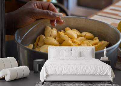 a Jamaican woman's hand  rests on a pan of ackee, one of Jamaica's famous fruits Wall mural