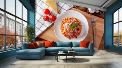 Spaghetti in a dish on a wooden background Wall mural