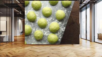 Top view natural green raw pandan bread bun dough on stainless steel bakery kitchen surface Wall mural