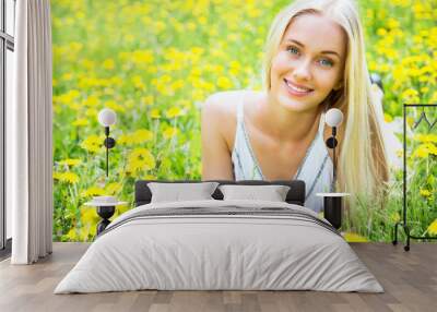 Beautiful young woman among the flowers Wall mural