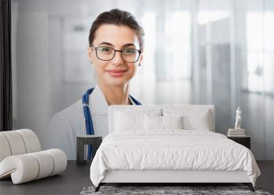 Portrait of a young female doctor Wall mural