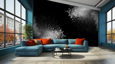 Freeze motion of white dust explosion on black background. Stopping the movement of white powder on dark background. Explosive powder white on black background. Wall mural