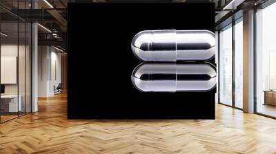 Levitating Chrome Pill on Black Background - Reflective Isolated Object for Modern Design and Health Concepts Wall mural