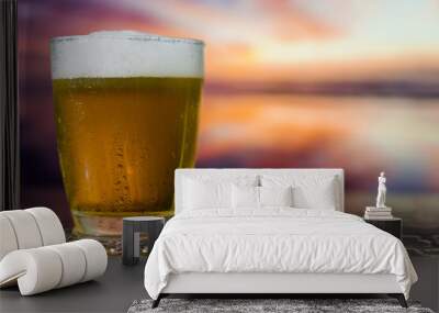 Glass of beer on a sunset Wall mural