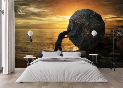 Business man pushing large stone up to hill , Business heavy tasks and problems concept. Wall mural