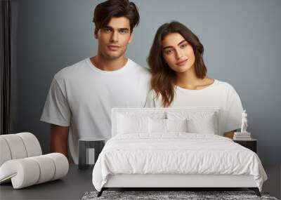 Attractive man and woman models in blank white t-shirt over gray background. Mockup shirt for branding, design, advertising, commerce. Unisex fashion. Generation ai. Wall mural