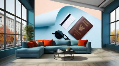 Top view travel concept with passport, credit card and sunglasses on abstract beach background Wall mural