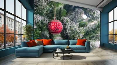 Close up of red bauble hanging from Christmas tree. Wall mural