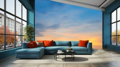 Beautiful Vivid sky painted by the sun leaving bright golden shades.Dense clouds in twilight sky in winter evening.Image of cloud sky on evening time.Evening Vivid  sky with clouds. Wall mural