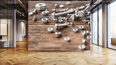 Selective focus of Many nuts and bolts  on wood background and copy space Wall mural