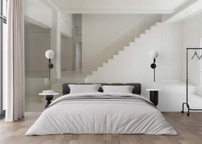 Modern Minimalist White Staircase Leading to Mezzanine Level with Blank Wall for Artwork or Company Values Display Wall mural