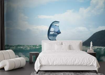 A man wing foils at sea using a hand held inflatable wing, riding a hydrofoil surfboard.  Turquoise sea, cloudy blue sky.  Wall mural