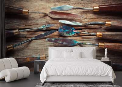 artist palette knifes on wooden rustic table, retro stylized Wall mural