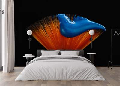 fan shaped paintbrush with paint in blue color at the tip. artistic flat fan shaped paintbrush again Wall mural