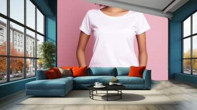 A young woman wearing white t-shirt mockup isolated on a pink background. female white t-shirt mockup without face Wall mural