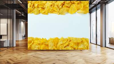 Yellow cornflakes with copy space in center on white background. Isolated food concept. Copy space. Wall mural