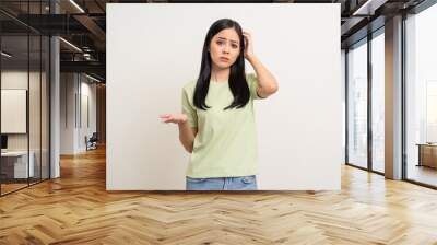 Angry asian woman emotional. Asian woman annoyed mad bad furious gesture. Unhappy expressions people upset confused emotional. Stressed female. Young lady standing feeling depressed dramatic scene Wall mural