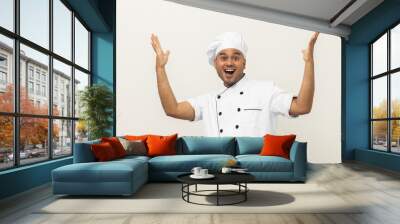 Happy Smiling Young handsome asian man chef in uniform arms stretch feeling successful excited on isolated background. Cooking indian man Occupation chef or baker in kitchen restaurant and hotel. Wall mural