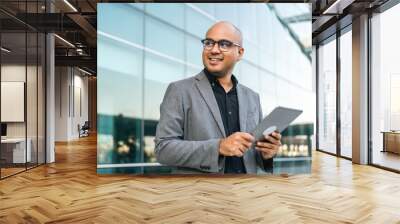 Senior manager business man in suit with tablet at the buildings downtown. Confident man using digital tablet looking towards their goals for success. Executive business man Wall mural