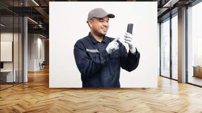 Technician workers in uniform maintenance service with smartphone. Profession of service industry house repair. Home services with cellphone isolated background. Wall mural