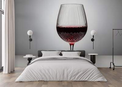 a glass of red wine isolated on plain background Wall mural